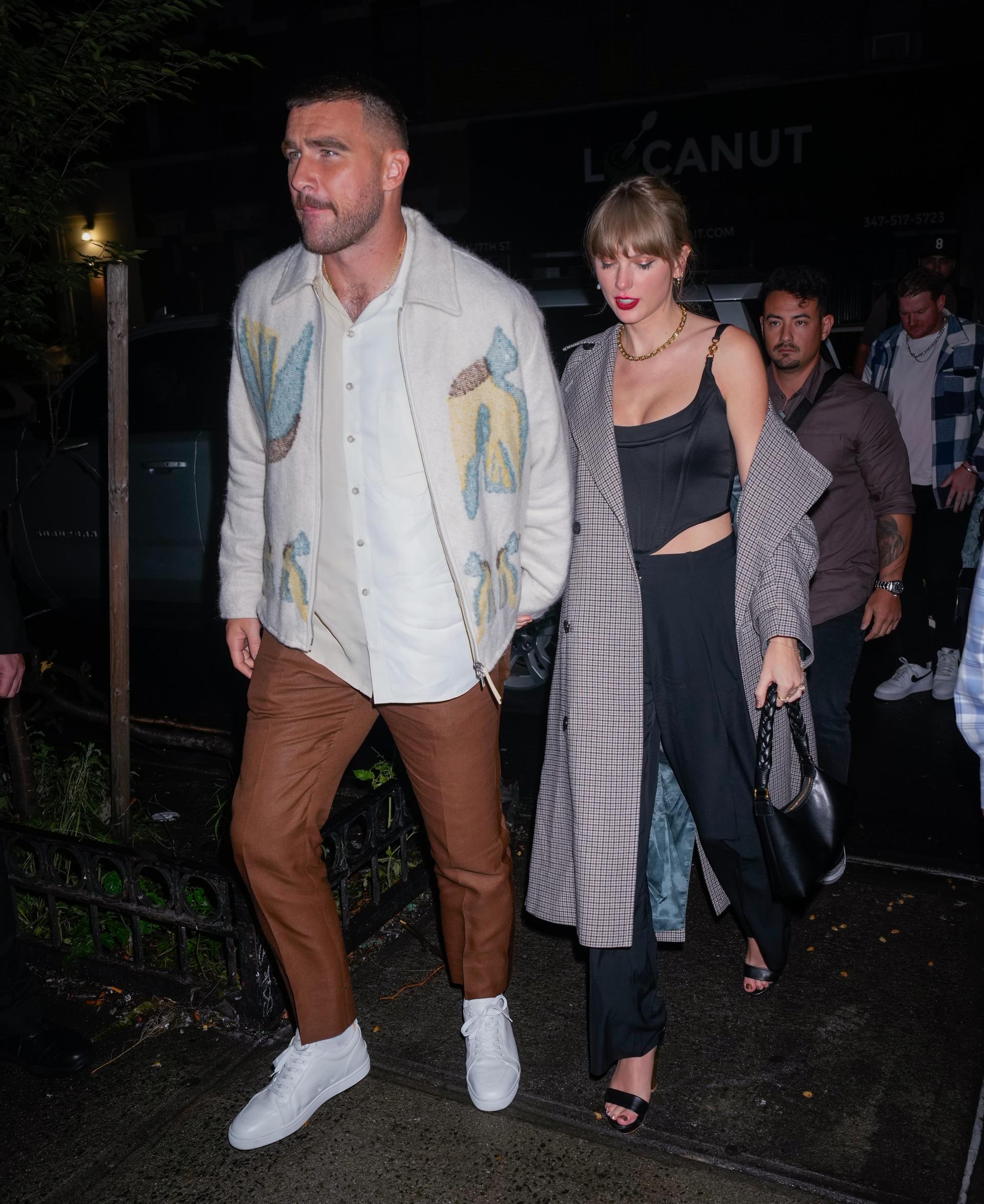 Travis Kelce and Taylor Swift arriving at the 
